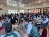 Peserta pelatihan mengenakan seragam hijau duduk rapi mengikuti sesi teori Akademi Jago Bangunan SMBR.